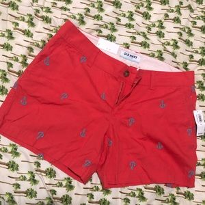 Red shorts with light blue anchors